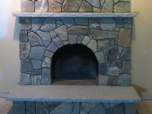 Stone veneer covers a fireplace in Windham New Hampshire