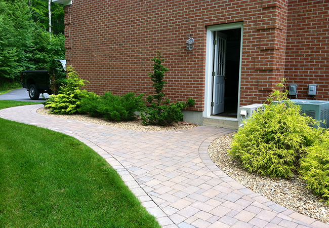 Curving paver walkways for a home in Amherst New Hampshire